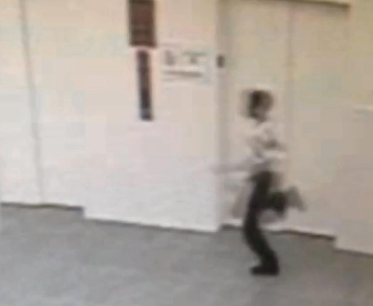 Still image from a security camera of the last known movements of Avonte Oquendo, seen here on October 4, 2013 as he runs towards an exit at his school on 51st Avenue in Queens.