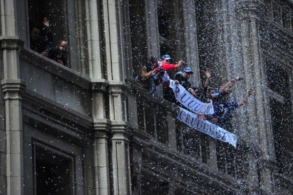 Thousands of fans line the streets in lower