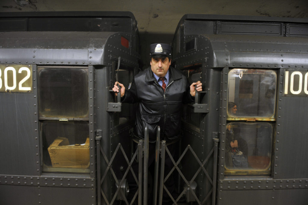 The Nostalgia Shoppers' Special Train runs on Sunday, December 9, 2012 from 2nd Ave., Manhattan to Queens Plaza. The fleet consists of vintage rolling stock that was in service from the 1930s to the 1970s and runs on Sundays through December 30. A conductor operates the doors between R9 car 1802 and R4 car 100.