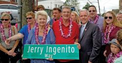 Family, friends and politicians gathered to remember the life of Jerry Ingenito during a street co-naming ceremony meant to honor the late Long Island City resident and youth basketball coach held Saturday, Sept. 21, at the corner of 38th Street and Greenpoint Avenue. Ingenito coached basketball for St. Raphaelrsquo;s Church CYO and Christ the King Regional High School. Pictured holding the street sign are Ingenitorsquo;s mother and father, Maryann and Richard Ingenito. Also pictured are wife Kelly; brother and sister-in-law Richard and Diane; nephew Nicholas; daughter Danielle; brother Jimmy; and City Council Member Jimmy Van Bramer. (photo: Nicholas Biondo) 