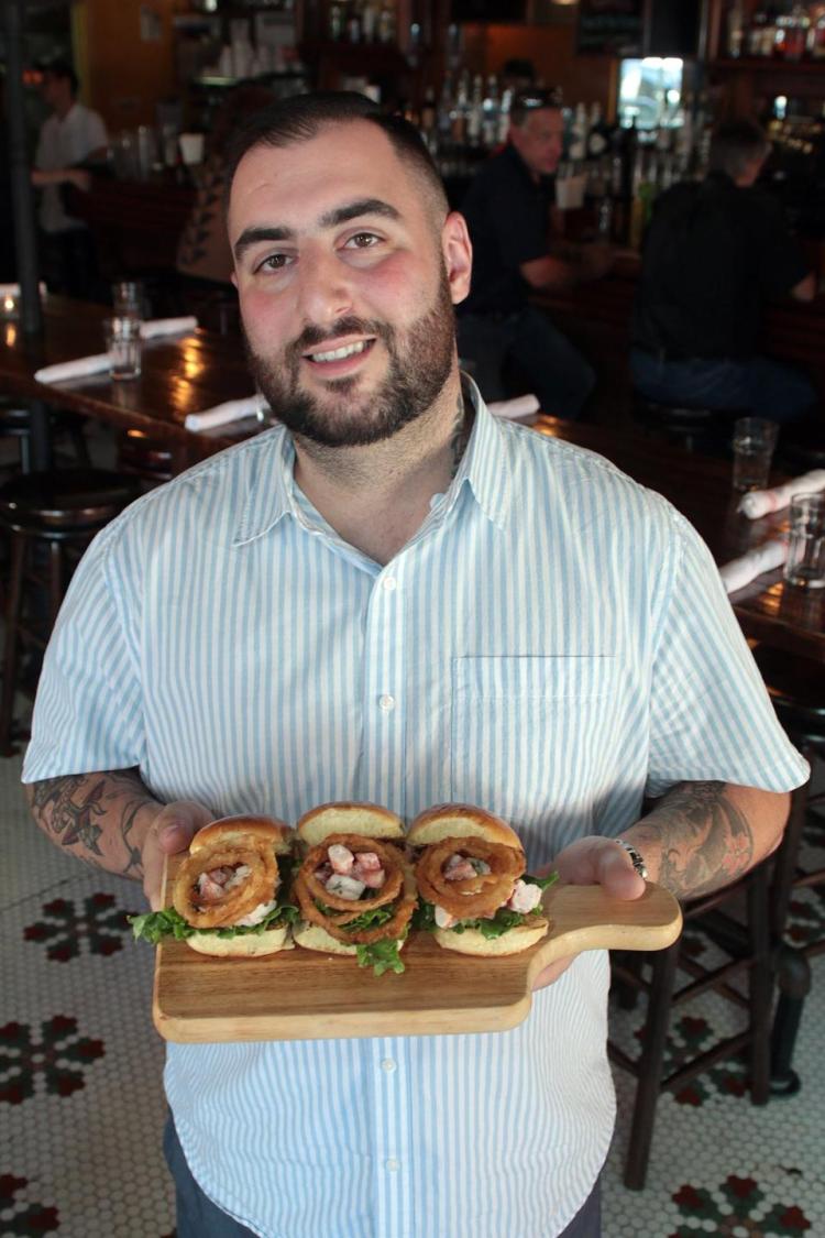 Brian Shornick, chef and manager at Dutch Kills Centraal, shows off his shrimp roll sliders.