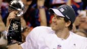 New York Giants quarterback Eli Manning holds the