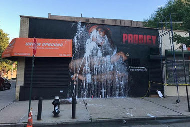  A mural of late rapper Prodigy after it was defaced in Queensbridge Friday night. Artists spent hours restoring the work, only to have it vandalized again on Sunday night or Monday morning. 