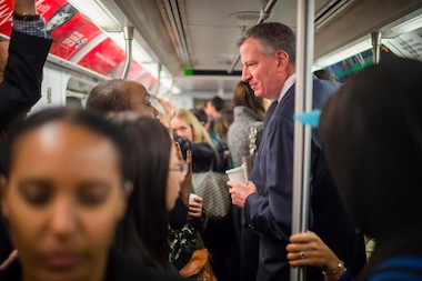  Mayor Bill de Blasio riding the subway in 2014. 