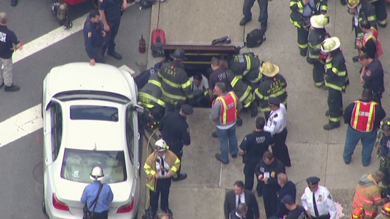 Dozens of firefighters and paramedics with stretchers converged