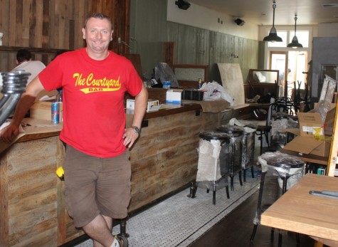 Pat Burke putting the finishing touches on his Vernon Blvd establishment