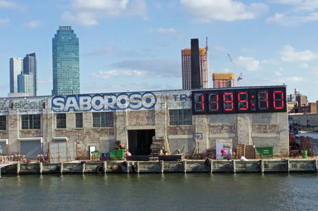  The display, affixed to a building on the Long Island City waterfront, is a clock counting down the timeleft in Donald Trump's presidency. 