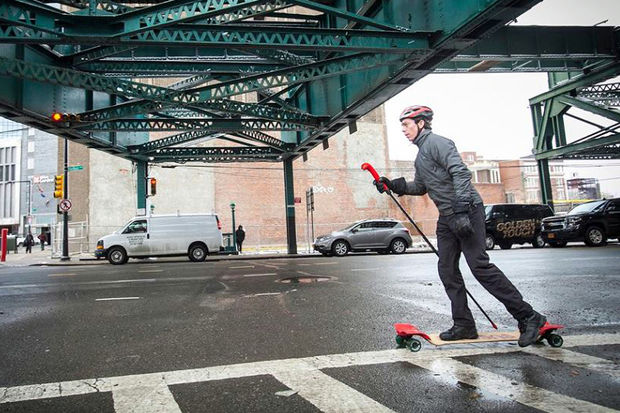  SpikeBoarding users ride a modified skateboard and propel themselves forward with a long spiked stick. 