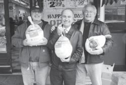 (L. to r.); Astoria / Long Island City Kiwanis Club Turkey amp; Food Drive Chairman Will Dionisio; Committee members Paul Halvatzis and George Perno in front of K amp; T Meats located on Broadway in Astoria. 