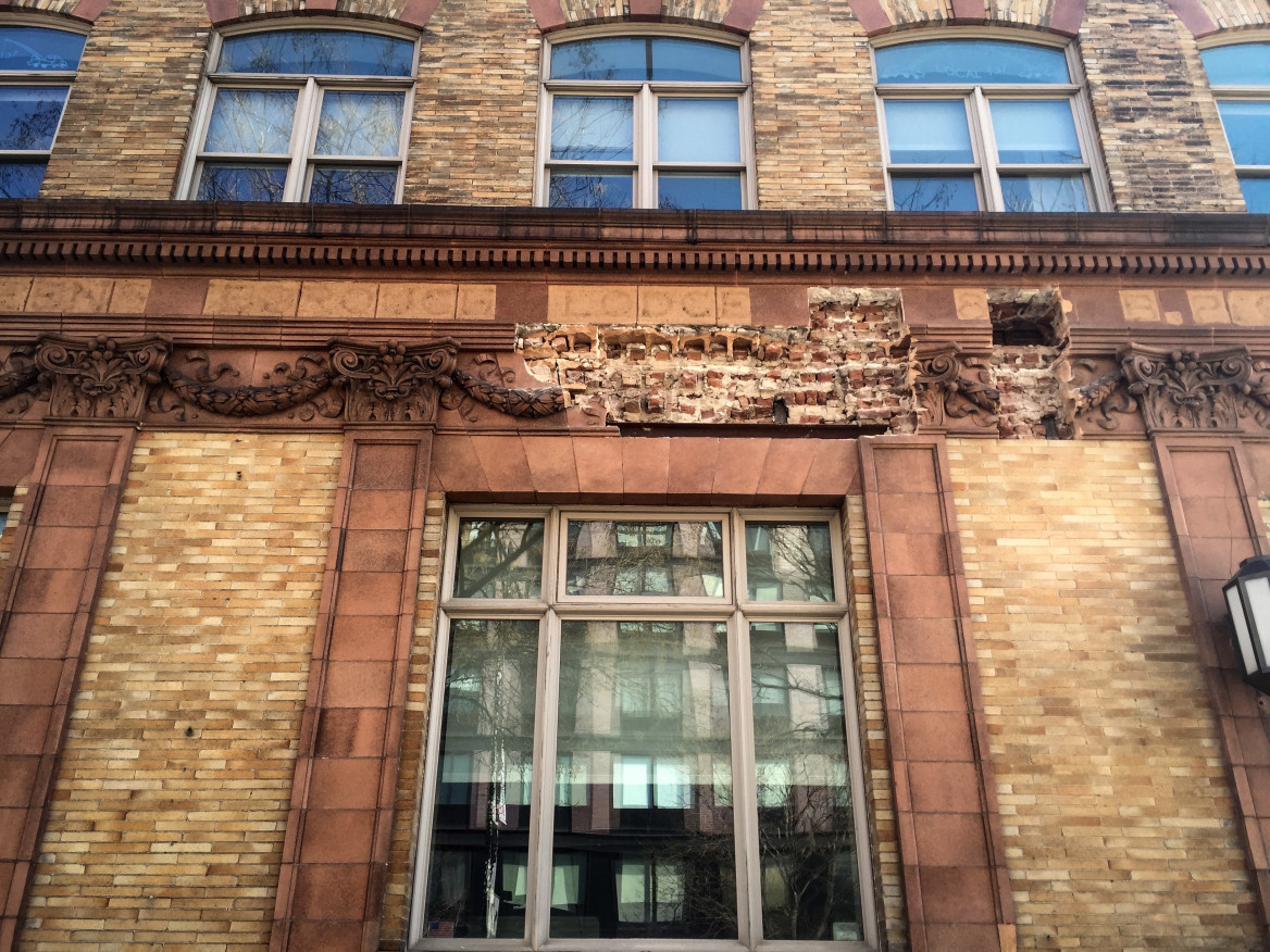 The center frieze, featuring a wreath and a elks head--what is described as the building's defining characteristic--was missing after workers began construction on the building. (Mary Kekatos)